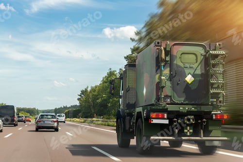 Preview: German armoured semi-trailer cargo truck carrier drives military convoy highway road. ALLIANCE