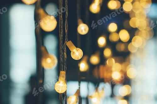 Preview: Abstract blurred of blue and silver glittering shine bulbs lights background.
