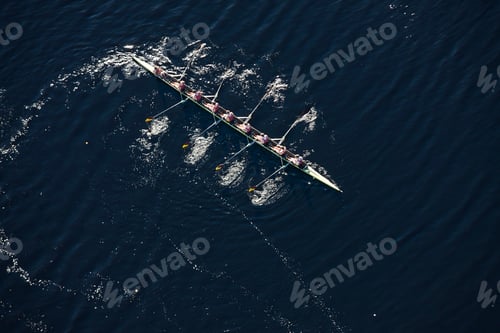 Preview: Elevated view of rowing eight in water