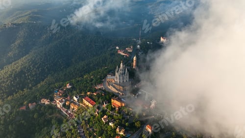 Preview: Aerial view of Barcelona Tibidabo above the clouds and fog, Catalonia, Spain