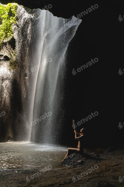 Preview: Beautiful slim girl sitting in semi position