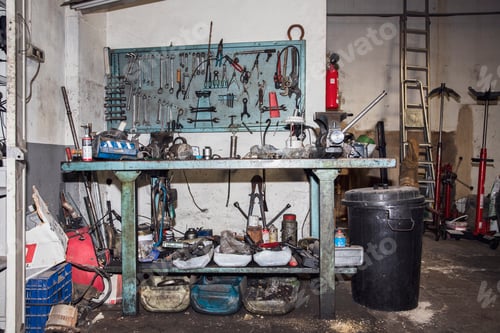 Preview: Messy and dirty mechanical workshop bench full of tools