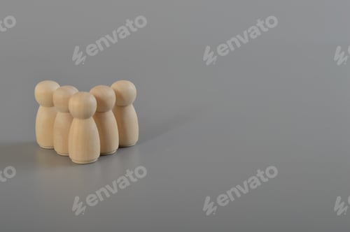 Preview: Wooden doll figures standing. People are united in a group. Consolidation, business management
