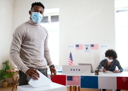 Preview: African-american man putting his vote in the ballot box, usa elections and coronavirus