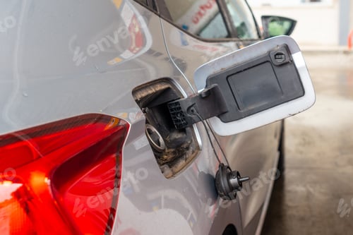 Preview: Refueling gasoline at the gas station. gray car