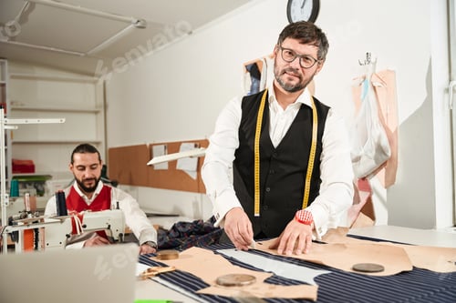 Preview: Joyous clothier and his coworker in workshop