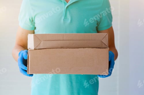 Preview: Сourier man delivers the package to the door, contact less delivery.