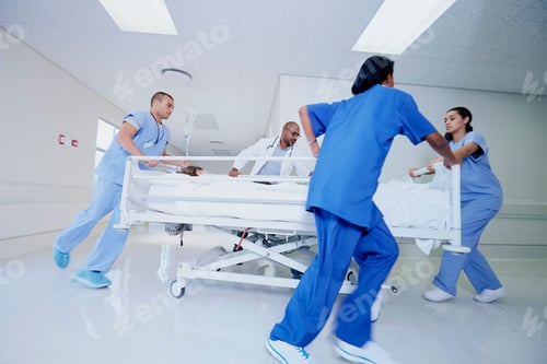Preview: Doctor and medical running with patient bed in hospital emergency