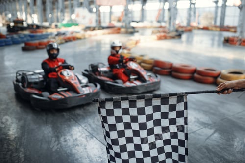 Preview: Two kart racers on start line, checkered flag