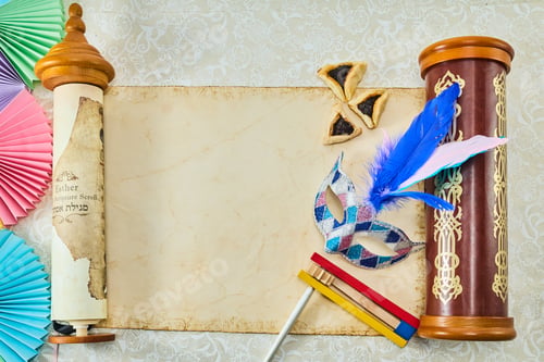 Preview: Purim Celebration Items. Festive Purim setup with Esther scrolls, Hamantaschen, and a mask