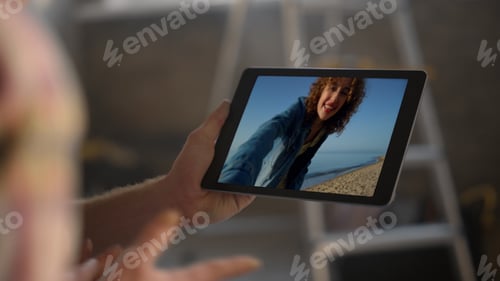 Preview: Lovely girl talk conference with boyfriend closeup. Smiling woman waving tablet