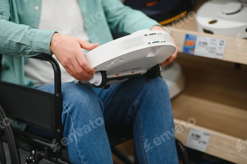 Preview: Customer in wheelchair choosing robot vacuum cleaner in electronics store