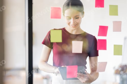 Preview: Business woman meeting at office and use post it notes in glass wall to share idea. Brainstorming bu
