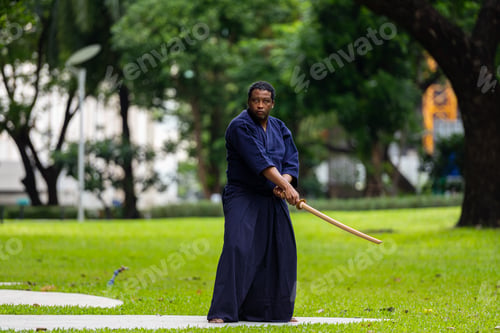 Preview: Handsome black martial artist man with martial arts costume of kendo