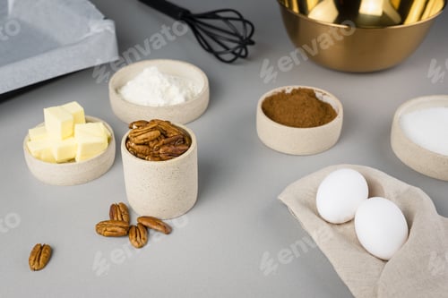 Preview: Close-up of the ingredients for brownie on a grey surface in the modern kitchen. Culinary blog.