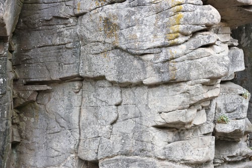 Preview: Light coarse natural rock stone background. Mining cliff rough front surface