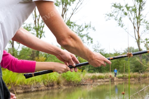 Preview: Father teaching his daughter how to fish