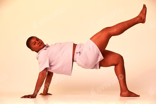 Preview: Taking Break. Overjoyed millennial plus-size black woman wearing white t-shirt and shorts, having