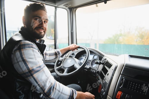 Preview: Happy male truck driver operating semi trailer