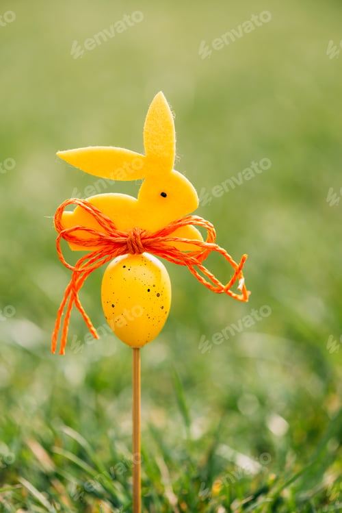 Preview: Easter background concept with yellow bunny figure