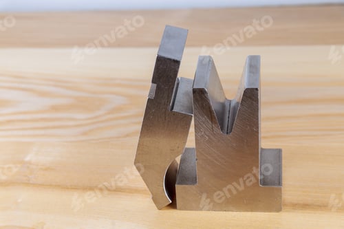 Preview: Bending tool on a wooden background. Sheet metalworking cnc press brake bending tool.