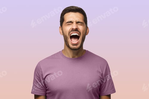 Preview: Closeup portrait of screaming with closed eyes crazy young male isolated on purple background