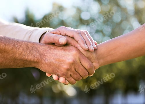 Preview: Itll all be alright at the end of the day. Shot of two unrecognisable men holding hands outdoors.