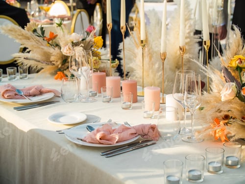 Preview: Beautiful outdoor wedding decoration in city. Candles and dried flowers and accessories with