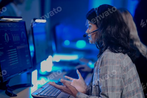Preview: late night strategy huddle intense focus Diverse professionals analyze performance reports