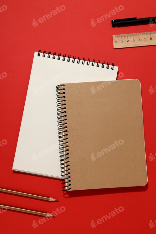 Preview: Two notebooks with stationery on a red background