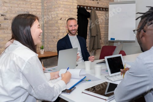 Preview: group of young entrepreneurs working in the conference room