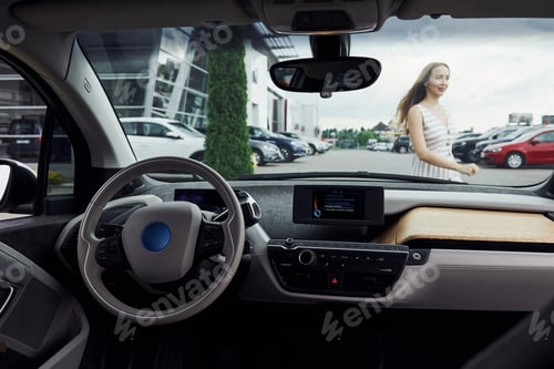 Preview: Inside of brand new modern electrical car. Particle view. Cropped photo