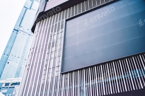 Preview: Urban cityscape with empty billboard on facade of building
