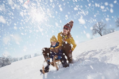 Preview: Joyful winter sledding adventure with snowflakes fluttering around