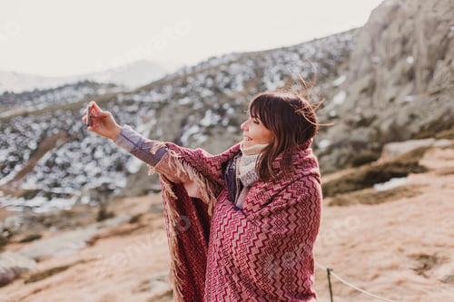Preview: Happy woman on the sunset in nature in autumn using mobile phone. fun outdoors