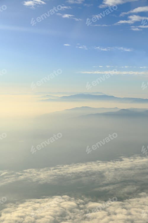 Preview: Blue sky with clouds and mountains background, aerial photography