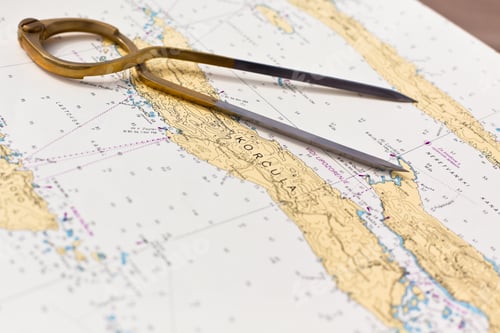 Preview: Pair of compasses for navigation on a sea map