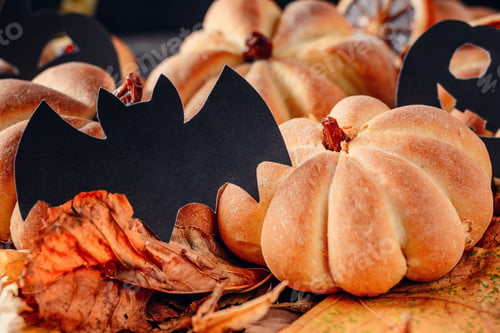 Preview: Homemade halloween cakes in the shape of pumpkin on dark background