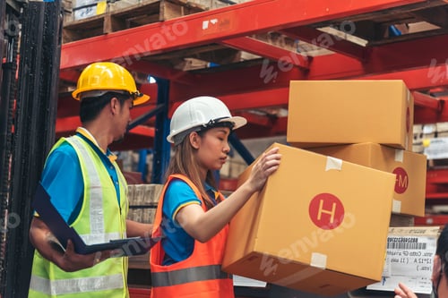 Preview: Warehouse management team use bar code scaner scan goods shelf writing checklist on clipboard