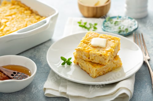 Preview: Cheesy cornbread freshly baked served with butter