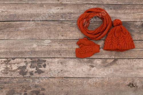 Preview: Cozy autumn accessories in rich orange on rustic wooden background
