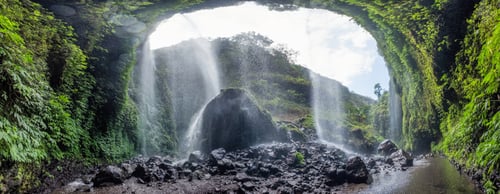 Preview: Majestic Madakaripura waterfall flowing on rocky cliff