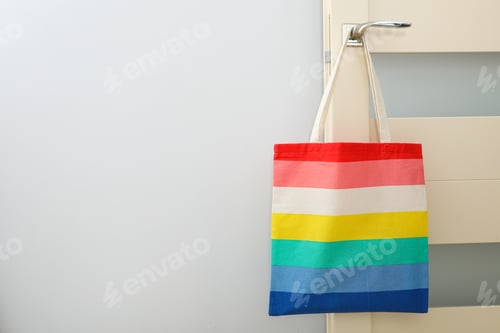 Preview: Concept of lgbt parade, rainbow shopper, on color background.
