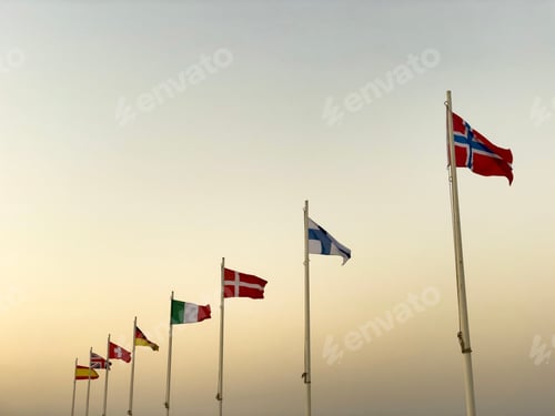 Preview: Looking up at flags of different countries placed on many poles in the main harbour of Rhodes