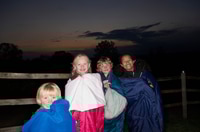 Preview: Children in sleeping bags at dusk
