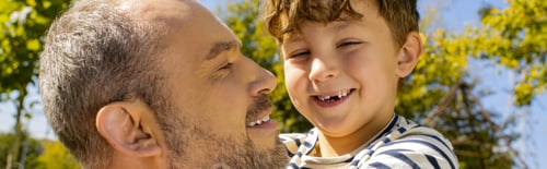 Preview: Joyful moments between a father and son enjoying a sunny day in the park