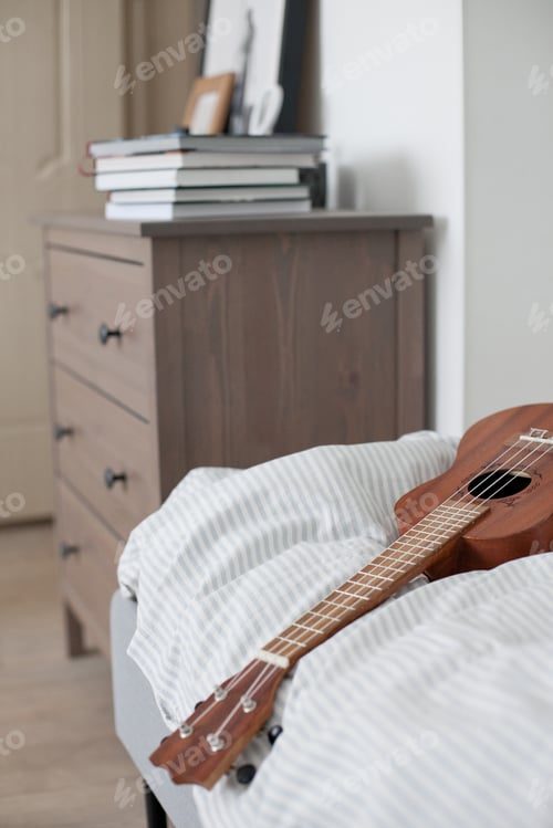 Preview: Ukulele lying on the bed, chest of drawers, bed vibes, home decor, interior design, cozy atmosphere