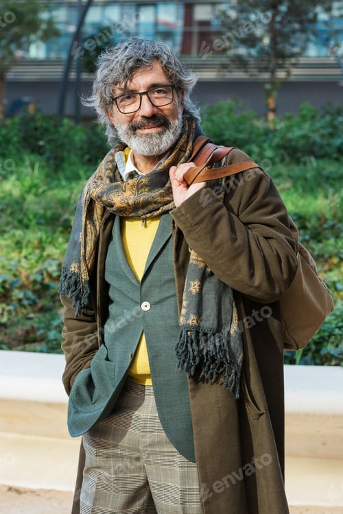 Preview: Middle-aged professional businessman standing on the street in the financial district of the city