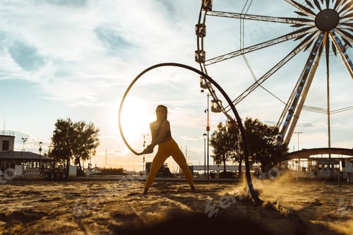 Preview: Woman doing fitness workout at a beach on sunset
