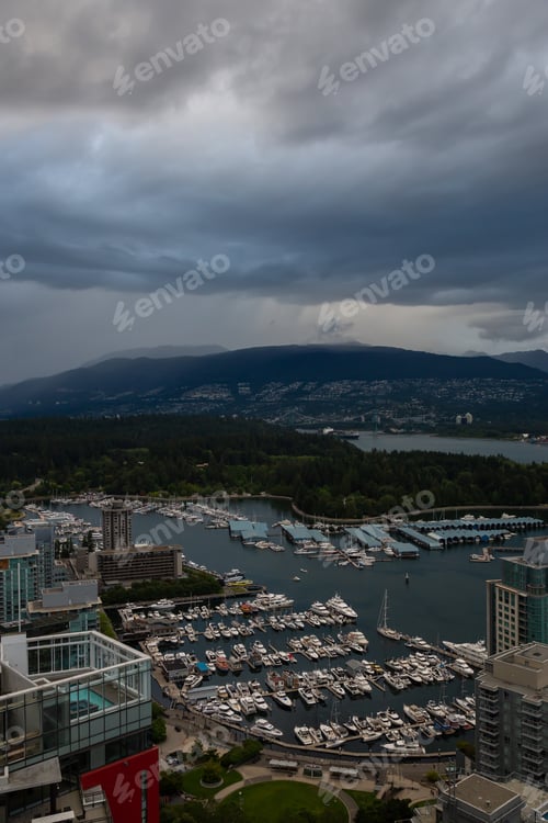 Preview: Aerial view of Downtown City during a stormy summer sunset